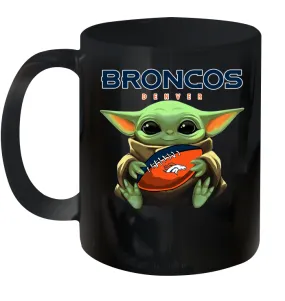 Baby Yoda Loves The Denver Broncos Star Wars Baby Yoda Hugs Broncos NFL Ceramic Mug 11oz